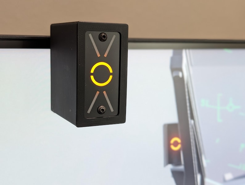 Illuminated AoA Indexer mounted above a flight simulator display