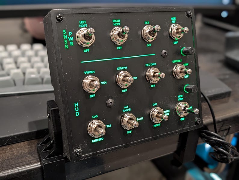 F-16 HUD and sensor control panel with green backlighting