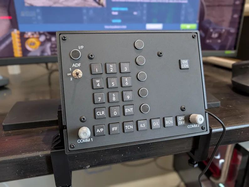 F-18 Basic UFC game controller with labeled keypad and silver communication knobs