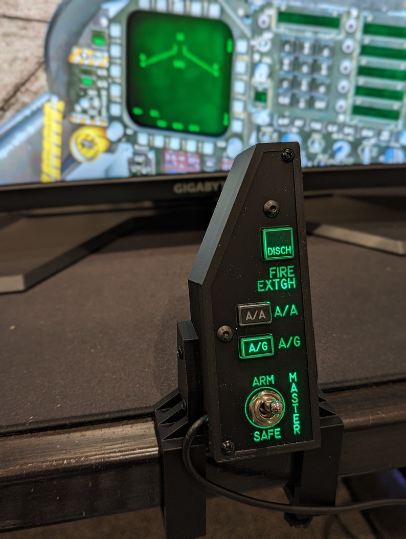 F-18 master arm panel with green backlit buttons