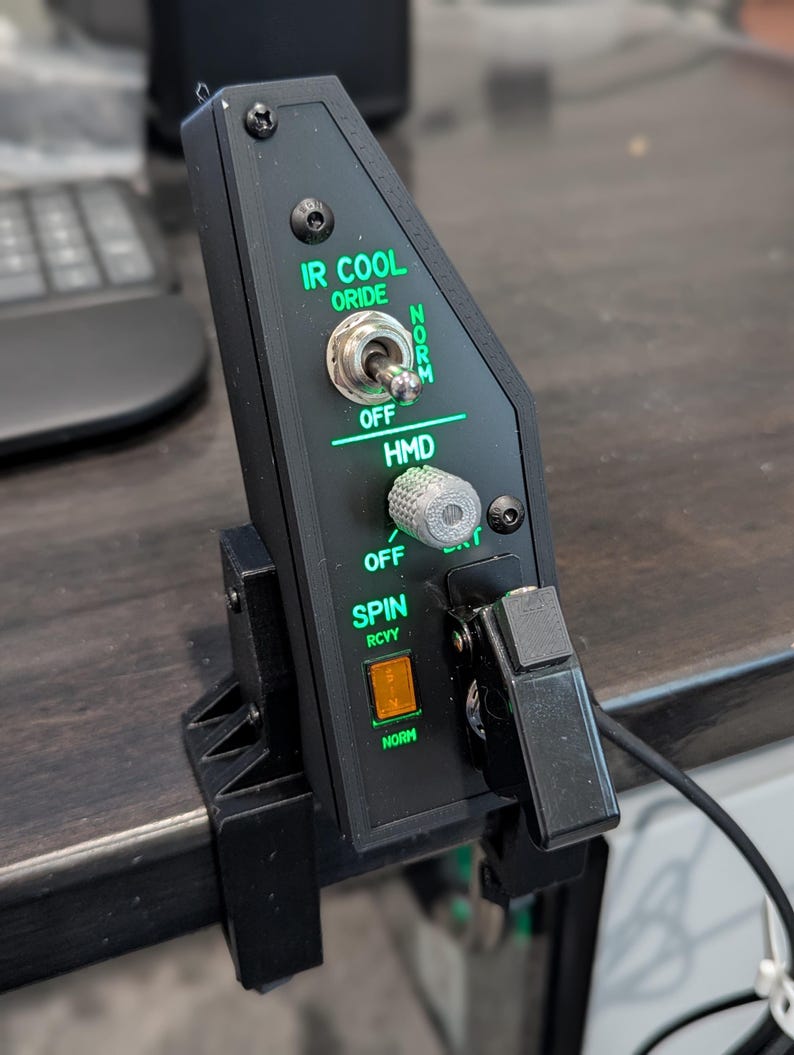 F-18 right instrument panel with green backlit controls