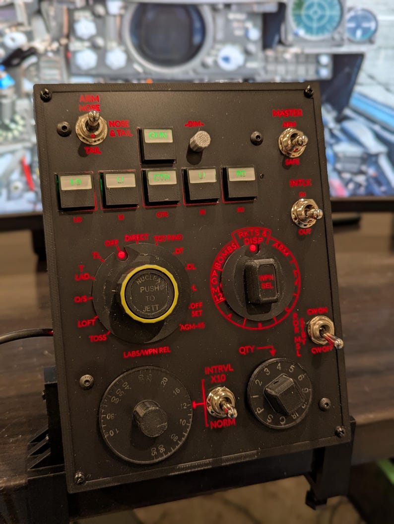 F-4 weapons control panel with red backlit controls